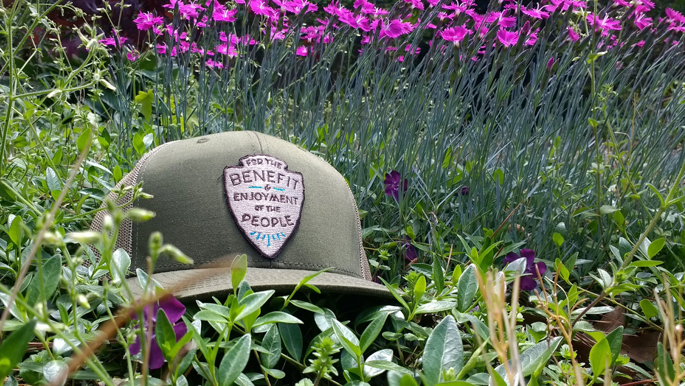trucker with a die-cut embroidered patch in nature