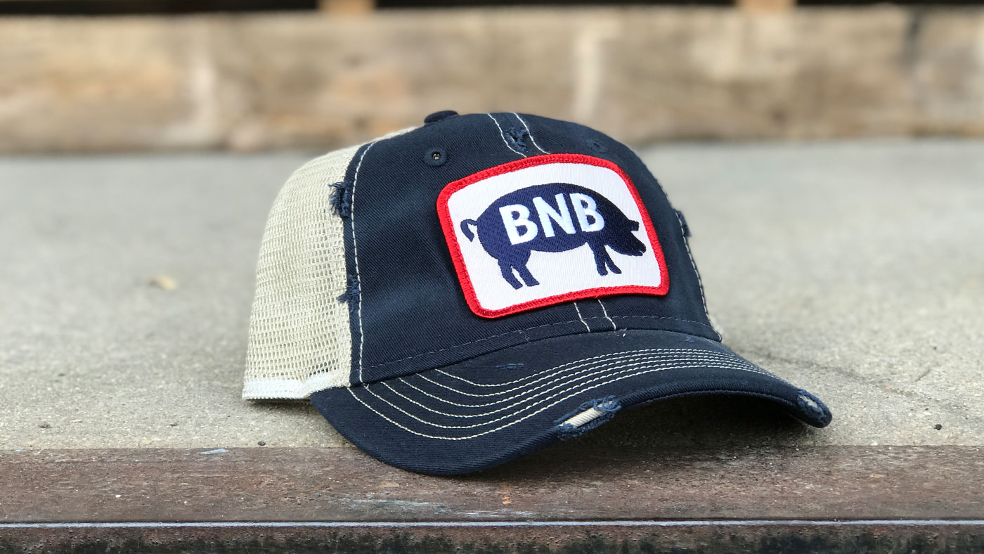Distressed trucker hat with custom BBQ patch 