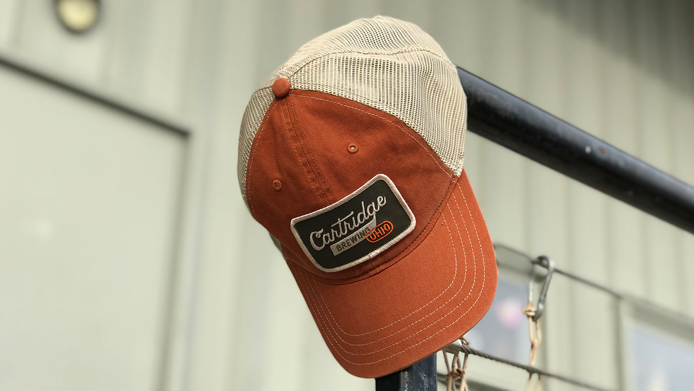 earth tone unstructured cap with Cartridge Brewery logo 