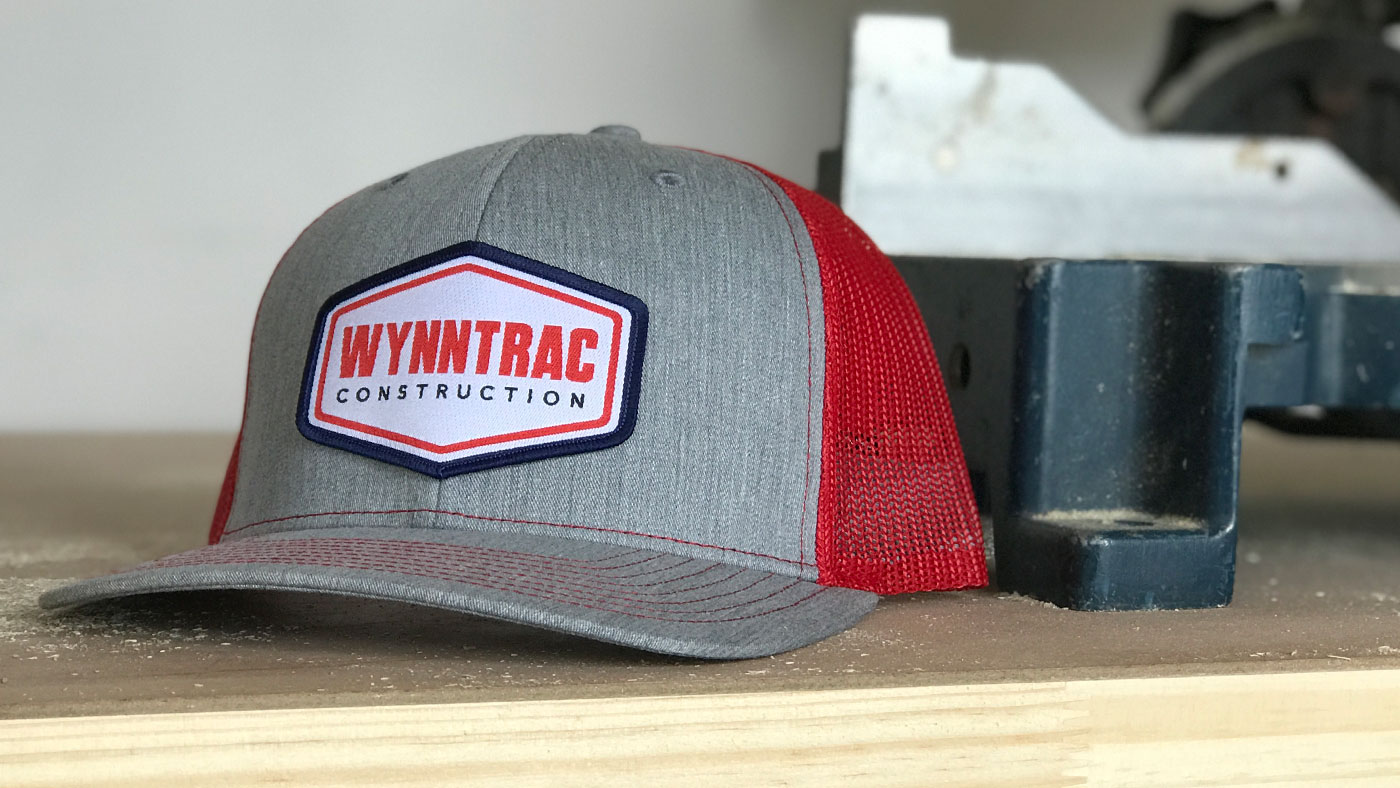 grey and red construction cap at the shop