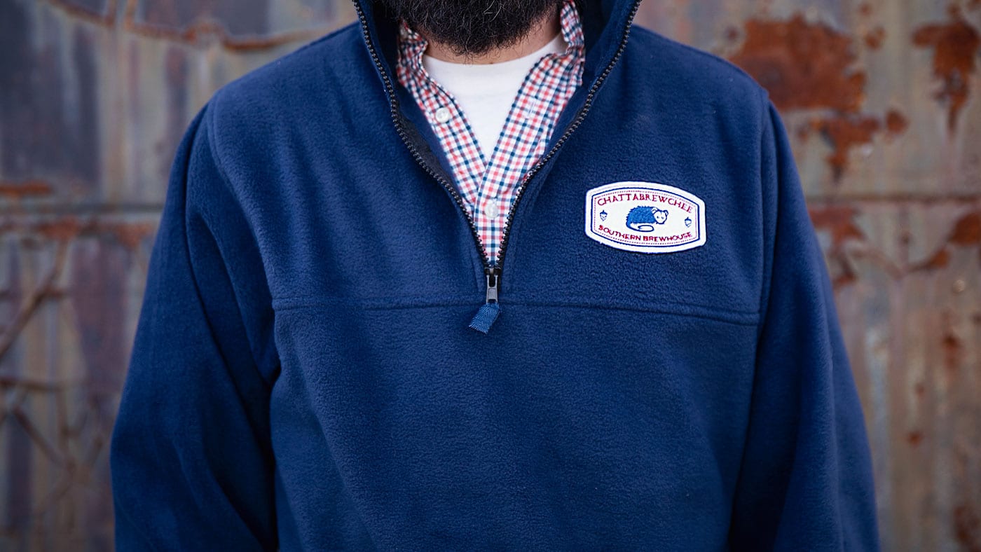 man wearing fleece jacket customized apparel with company logo 