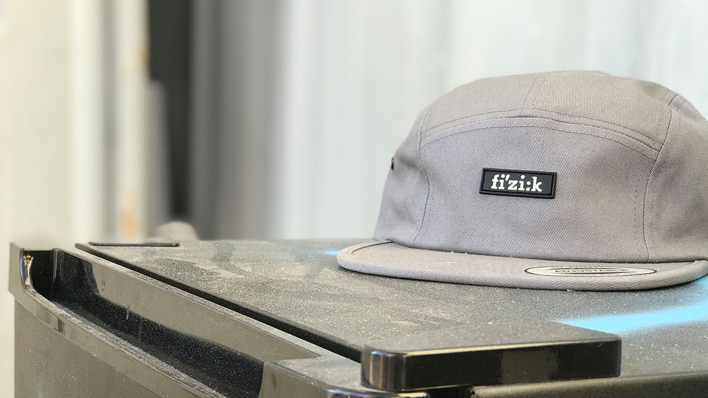 Minimalist Yupoong 7005 Camper cap with small PVC Patch 