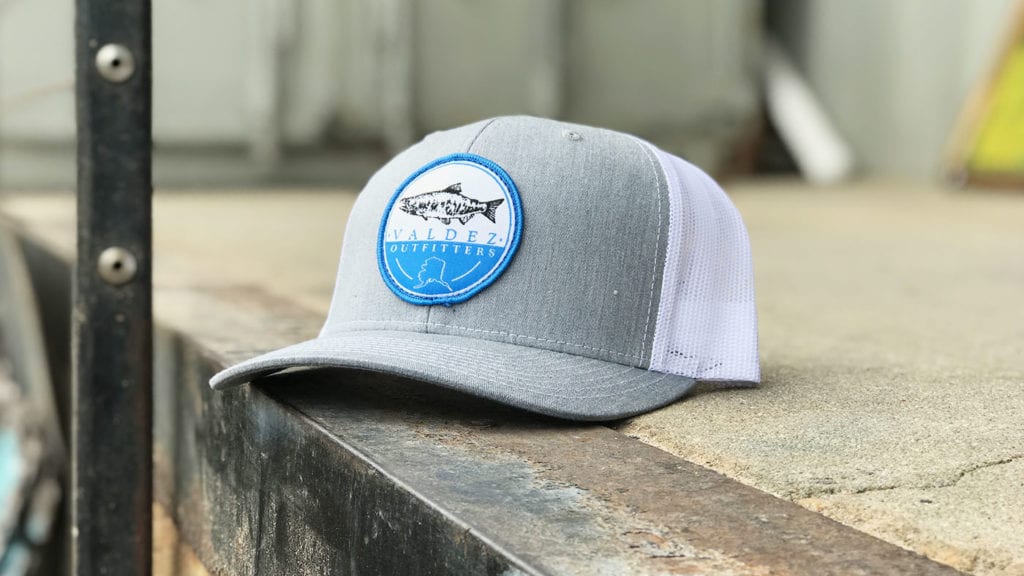 Custom fishing outfitters patch on heather grey cap