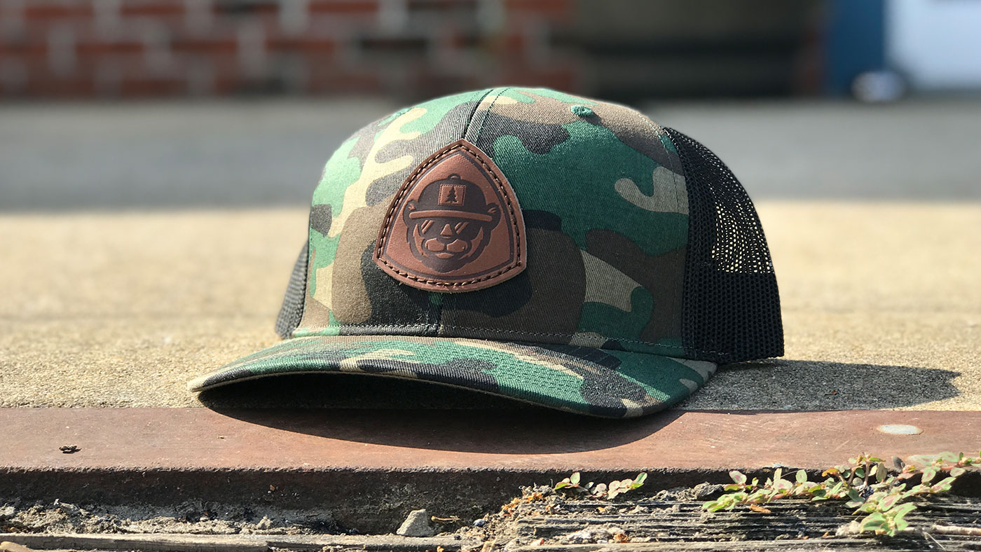 leather Custom Patch Hats logo on Camo trucker