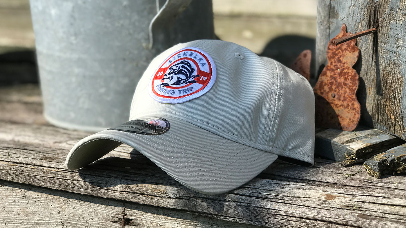 Performance fishing cap on a pier