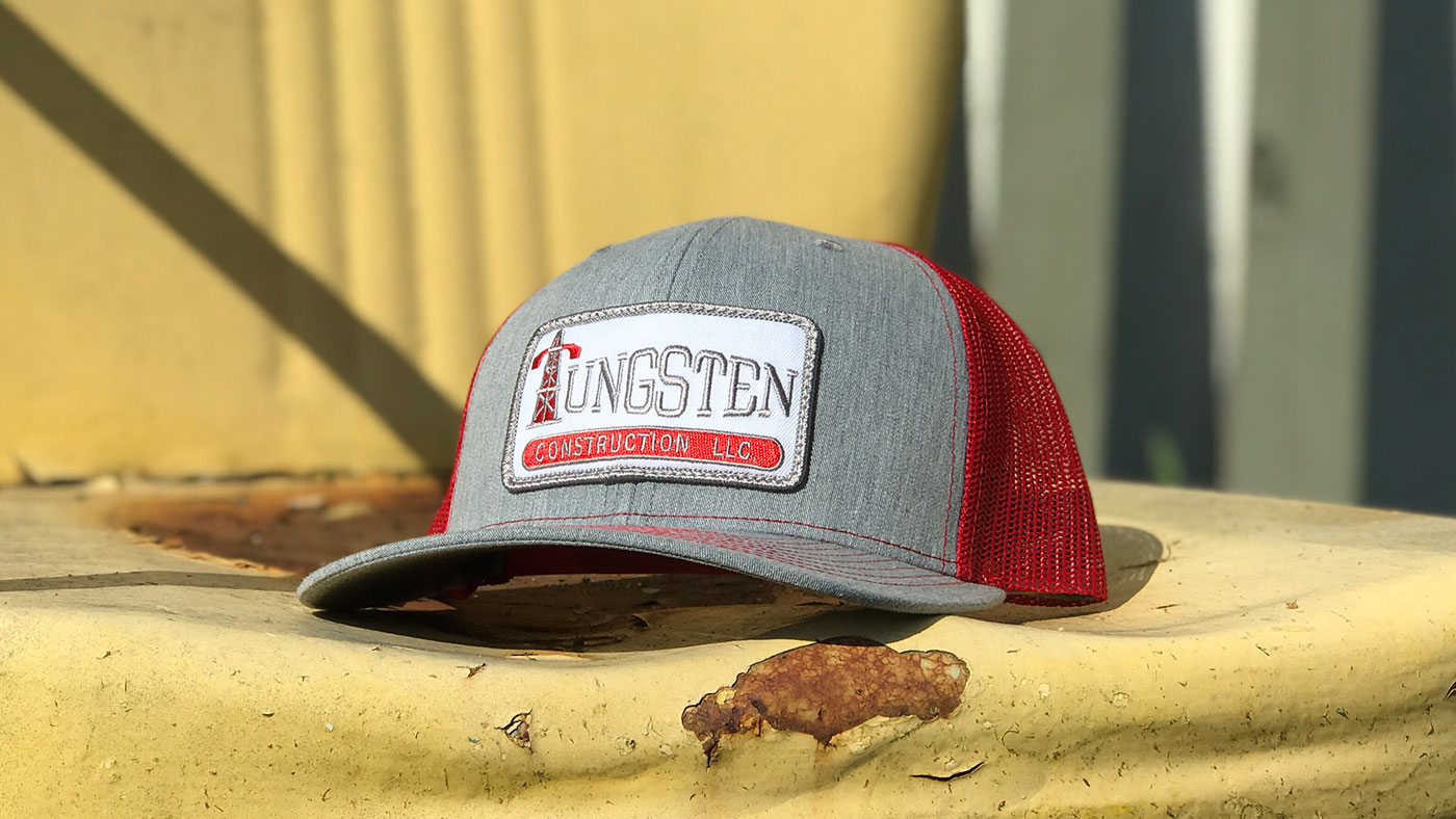 Red mesh cap with company logo name