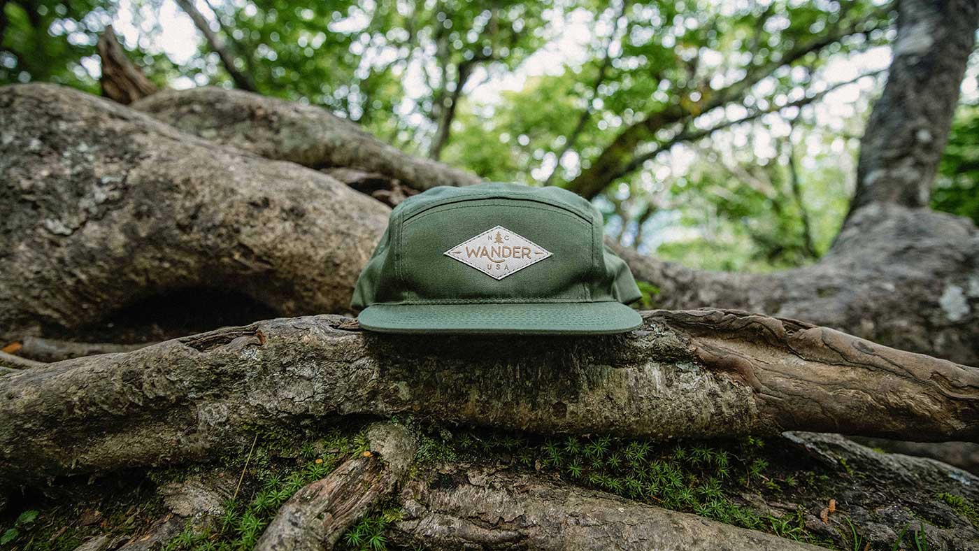 woven patch on Richardson camp hat on tree