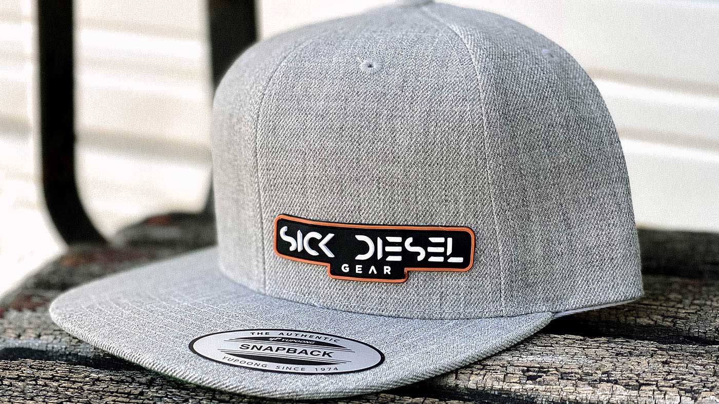 A grey flatbill with a bold company logo 