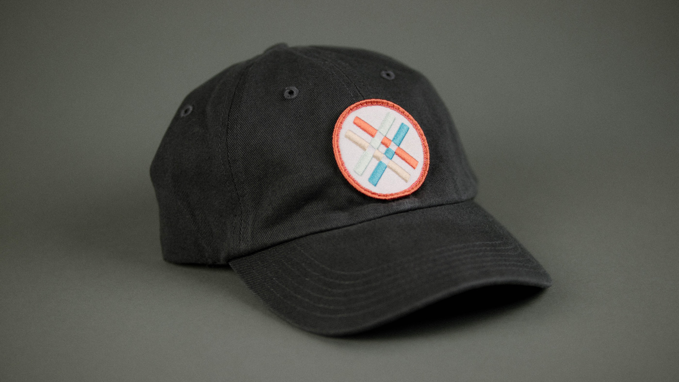black ball cap with a custom edgy patch design