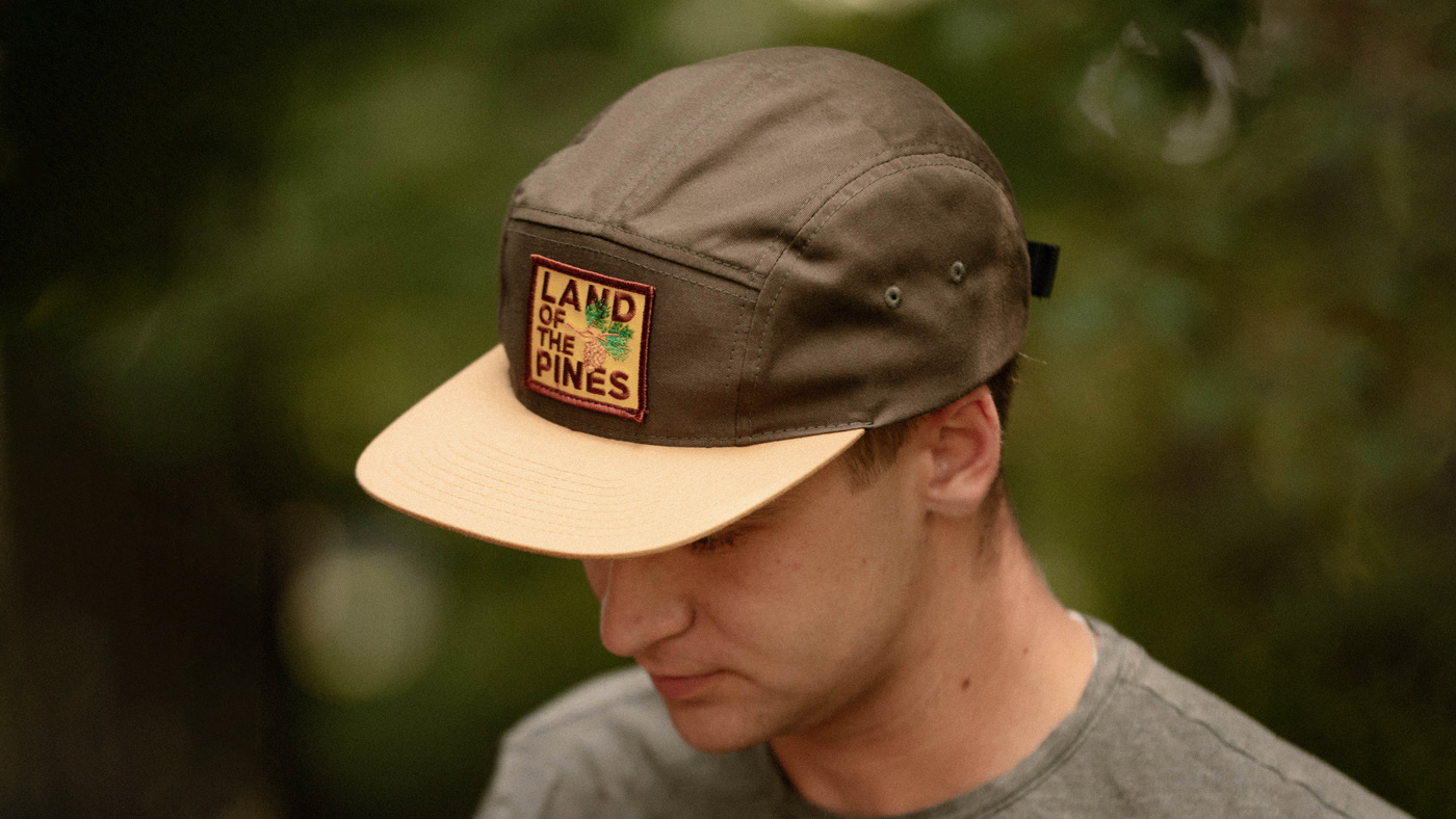 Camp hat guy in the woods