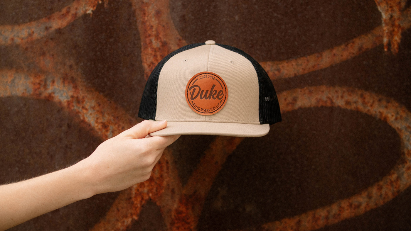 Richardson 511 flat bill trucker with stamped leather patch