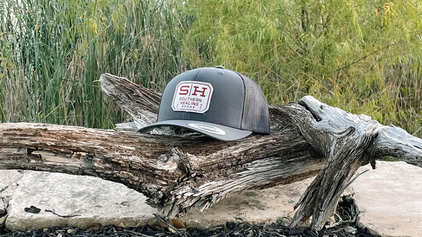 yupoong trucker patch hat outdoors with sweet patch