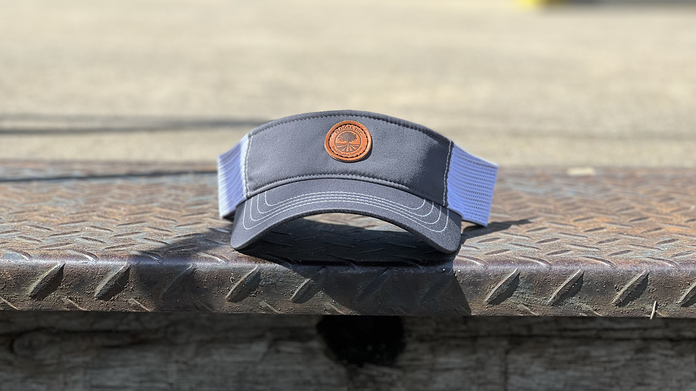 visor with custom flooring company logo