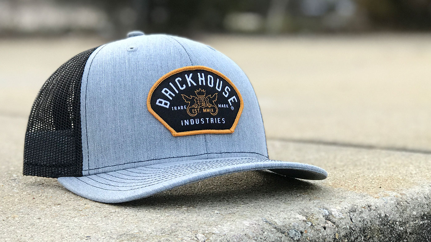 Custom Clothing Brand Patch Hat Customized gold border patch on a Richardson trucker