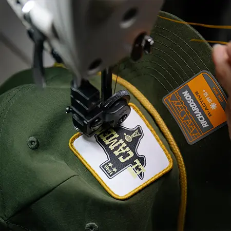 Machine stitching custom fabric patch onto rope hat