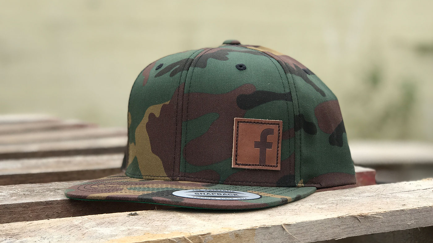 facebook stamped leather patch on classic green camo yupoong 