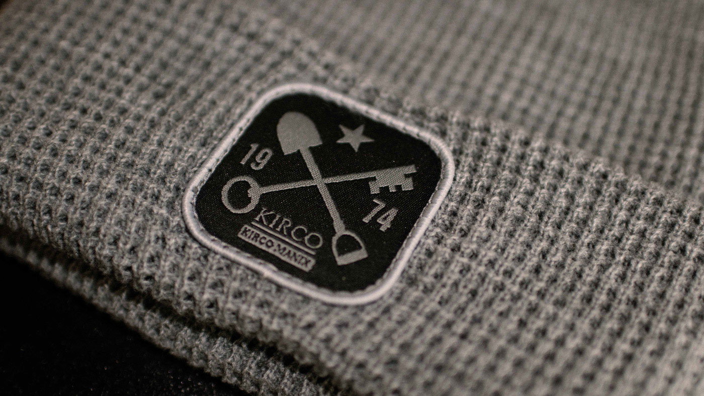 Heather Grey Waffle Knit Beanie Kirco Patch closeup of woven patch on grey R146 waffle beanie