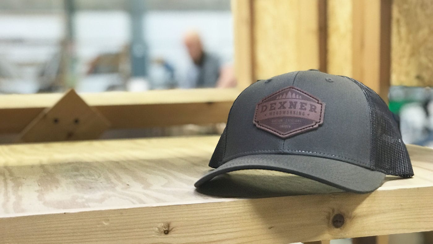 Low Profile Leather Patch Hat Dark brown leather patch hat at a woodshop