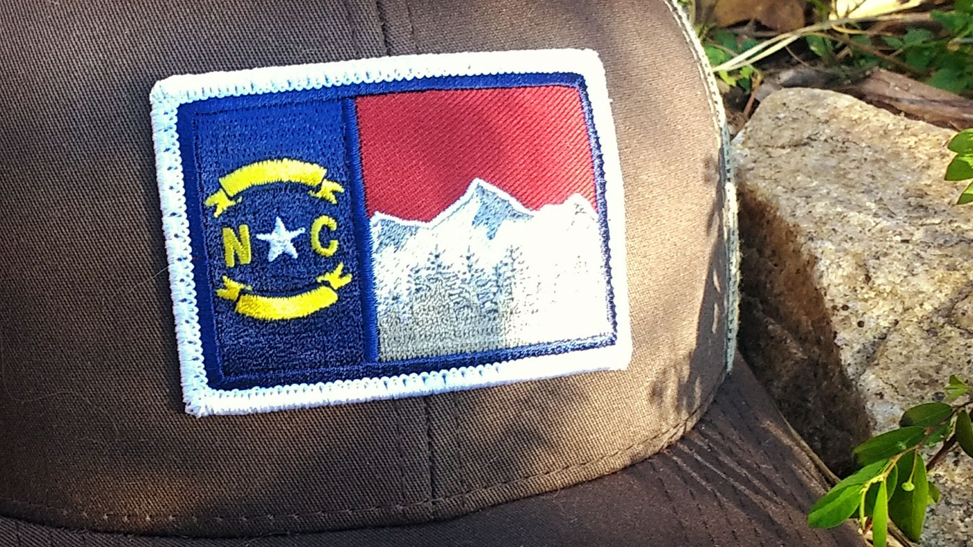 Outdoors Custom Patch Hats Arched ranch patch on forest green Richardson 115 trucker