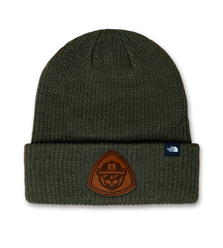 Custom TNF beanie with engraved leather patch branding.