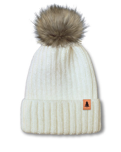 Custom pom beanie with suede clip label for logo placement.