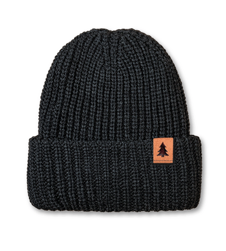Chunky knit cuffed beanie with leather clip label logo.