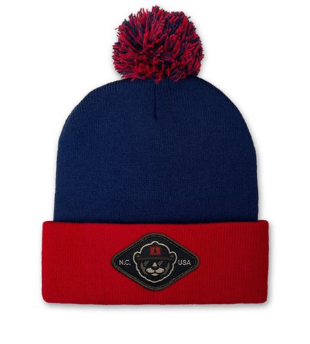Sportsman pom-pom beanie with woven patch logo, bulk custom hats.”